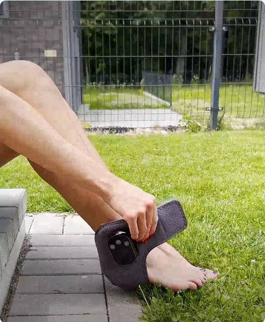 Person applying EMSense foot massager